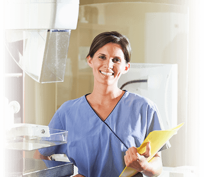 Smiling nurse holding paperwork