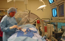 surgeon prepares to place stent