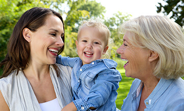 woman with her mother and young daughter