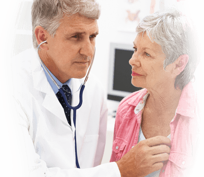 physician listens to the heartbeat of a older female patient