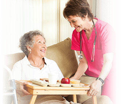 nurse giving food to a recovering patient