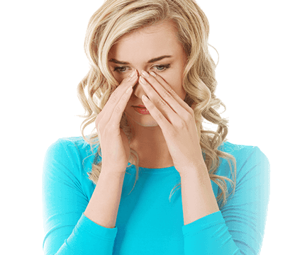 woman holding her nose while sneezing